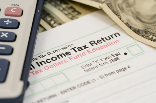 Picture of tax return form and money