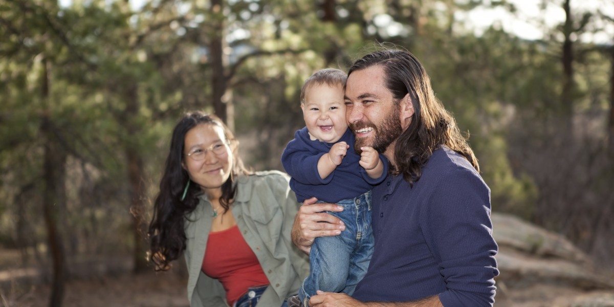 Young family enjoying a day in nature, shallow DOF, father and son in focus