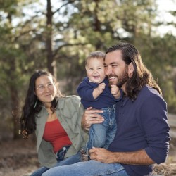 Young family enjoying a day in nature, shallow DOF, father and son in focus