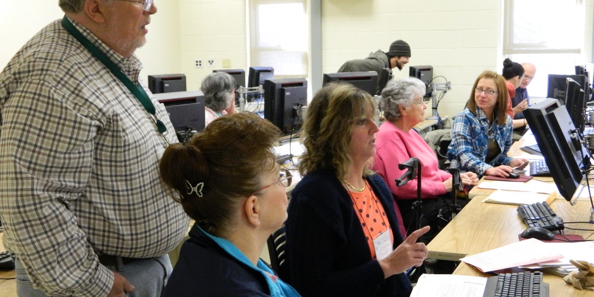 People preparing taxes at computer