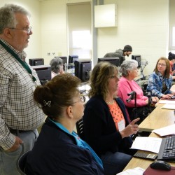 People preparing taxes at computer