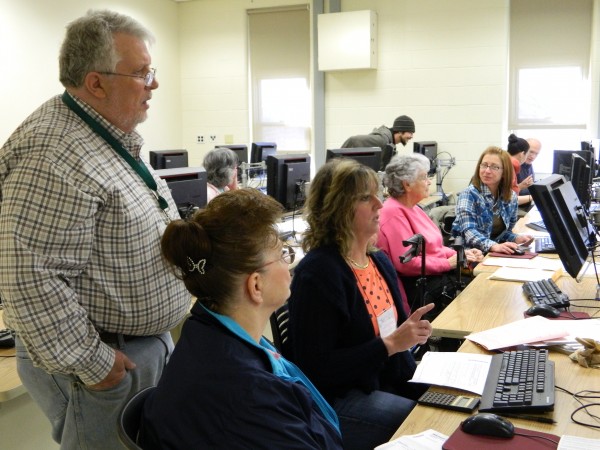 People preparing taxes at computer