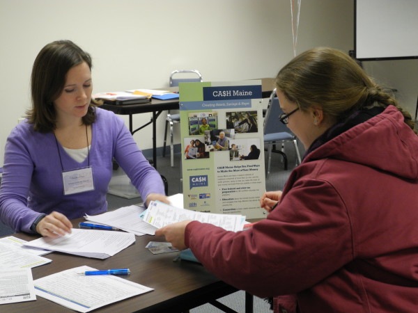 Volunteer helping a tax filer