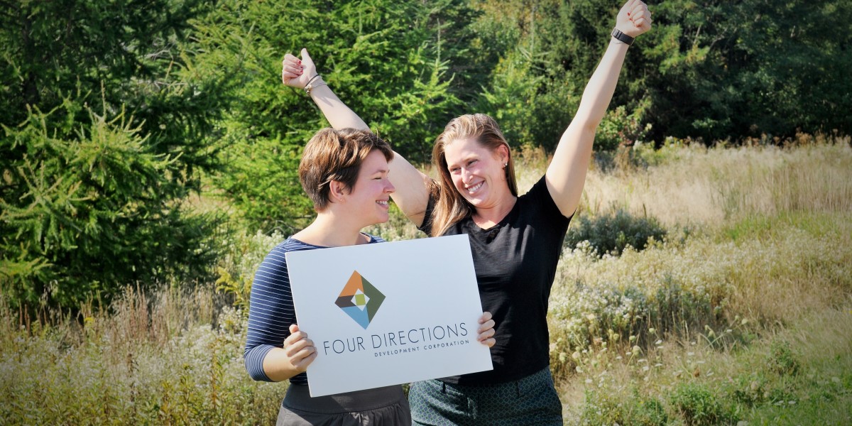 Girls standing with a sign