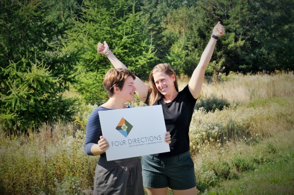 Girls standing with a sign