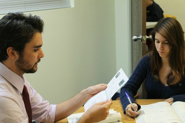 Man and women studying at a table.