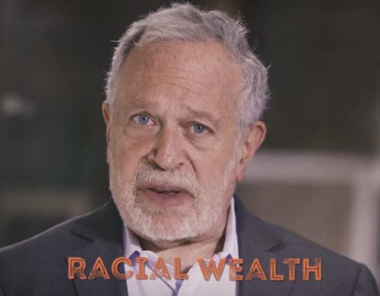 Man with racial wealth text