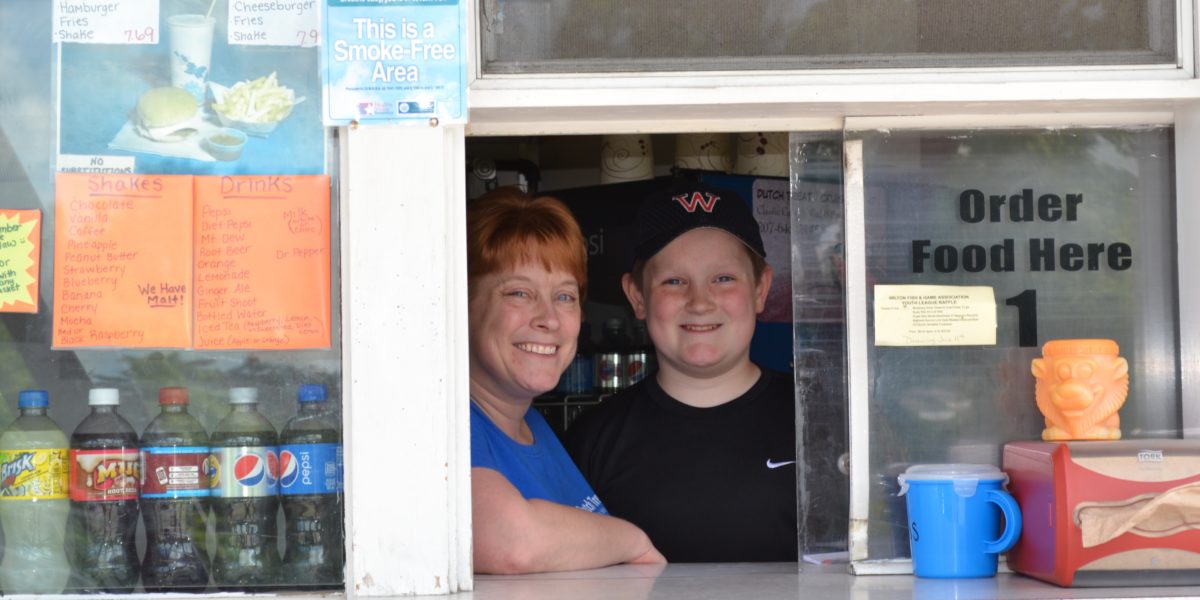 Mother and son at window of the Dutch Treat