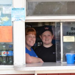 Mother and son at window of the Dutch Treat