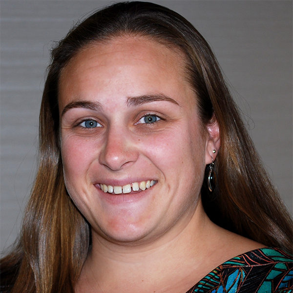 smiling young woman with long brown hair