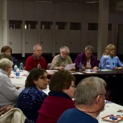 several people sitting at tables