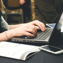 Woman's hands typing on laptop computer