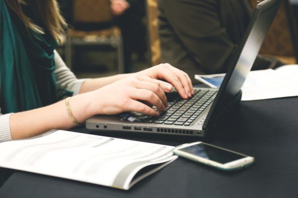 Woman's hands typing on laptop computer