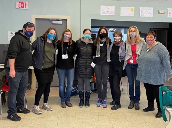 Group of volunteers wearing masks