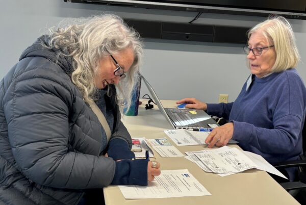 photo of Bowdoinham CA$H volunteer helping prepare taxes for community member