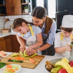mother and kids cooking in their kitchen